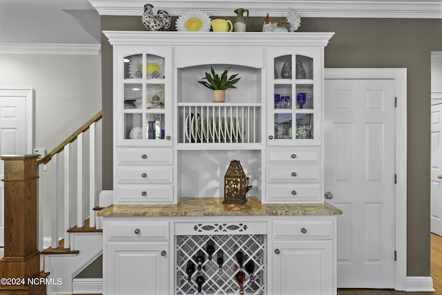 390 Whitebridge Rd, Hampstead, NC 28443 - bar with baseboards, stairs, and ornamental molding