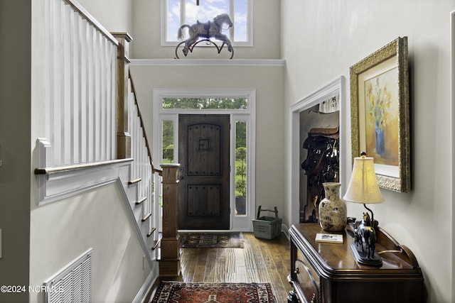 390 Whitebridge Rd, Hampstead, NC 28443 - foyer with stairway, a high ceiling, visible vents, and wood finished floors