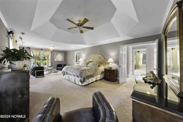 390 Whitebridge Rd, Hampstead, NC 28443 - carpeted bedroom featuring baseboards, ornamental molding, ceiling fan, visible vents, and a raised ceiling