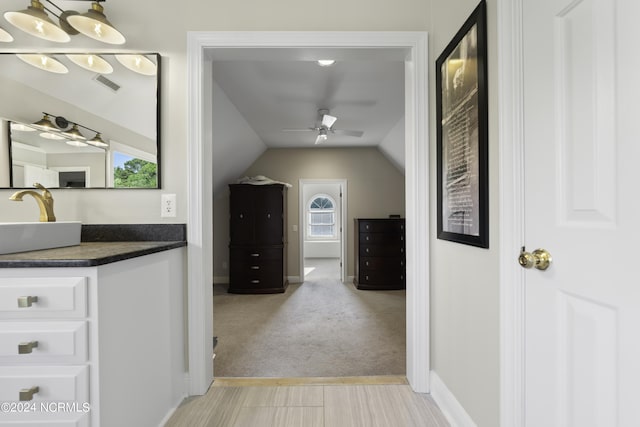 390 Whitebridge Rd, Hampstead, NC 28443 - hall featuring lofted ceiling, baseboards, visible vents, and a sink
