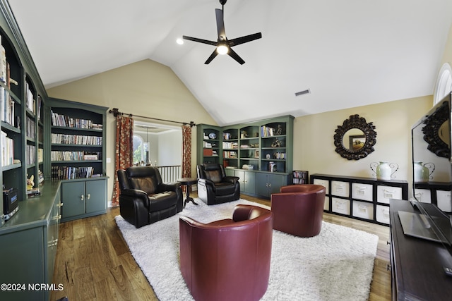 390 Whitebridge Rd, Hampstead, NC 28443 - living area with ceiling fan, wood finished floors, visible vents, and vaulted ceiling