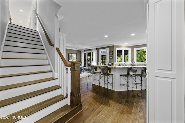 390 Whitebridge Rd, Hampstead, NC 28443 - staircase featuring recessed lighting, crown molding, and hardwood / wood-style flooring