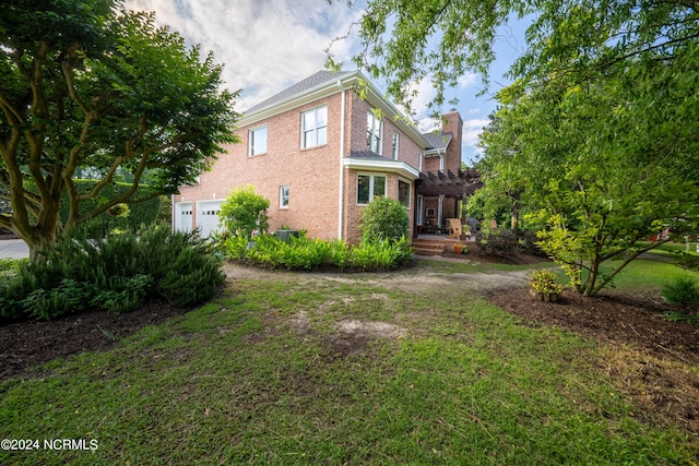 390 Whitebridge Rd, Hampstead, NC 28443 - exterior space featuring a pergola, a chimney, brick siding, and a lawn