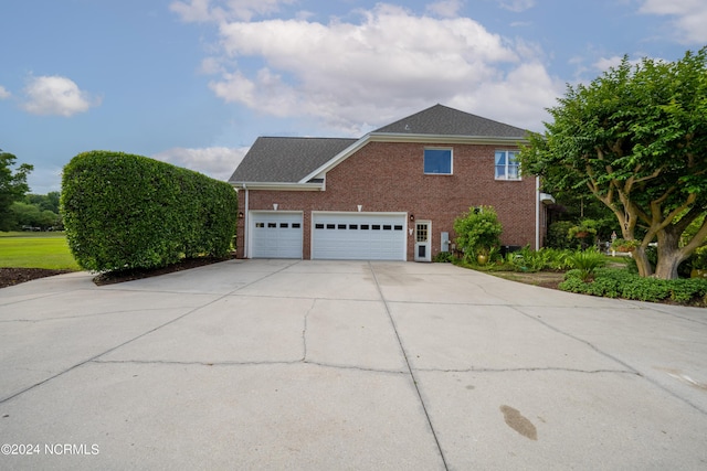 390 Whitebridge Rd, Hampstead, NC 28443 - view of side of property featuring brick siding and driveway