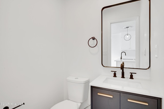 half bath with toilet and vanity