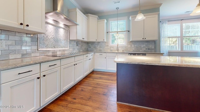 149 Mardella Way, Holly Ridge, NC 28445 - kitchen featuring wall chimney exhaust hood, crown molding, black electric stovetop, white cabinetry, and dark wood finished floors