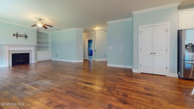 149 Mardella Way, Holly Ridge, NC 28445 - unfurnished living room with ceiling fan, dark wood-type flooring, crown molding, a tile fireplace, and baseboards