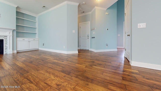 149 Mardella Way, Holly Ridge, NC 28445 - unfurnished living room featuring dark wood-style floors, ornamental molding, baseboards, and a tiled fireplace