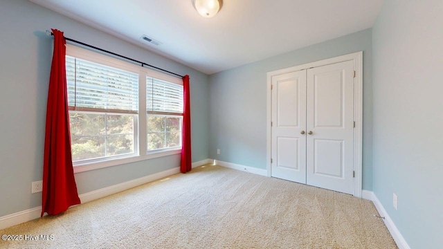 149 Mardella Way, Holly Ridge, NC 28445 - unfurnished bedroom with carpet, baseboards, and a closet