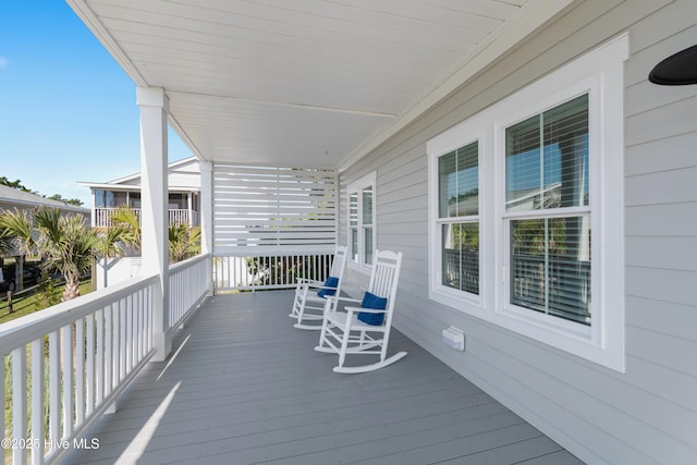 1063 Tide Ridge Dr, Supply, NC 28462 - deck featuring covered porch