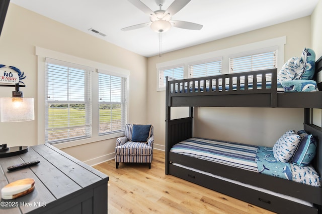 1063 Tide Ridge Dr, Supply, NC 28462 - bedroom with light wood-style floors, baseboards, and ceiling fan