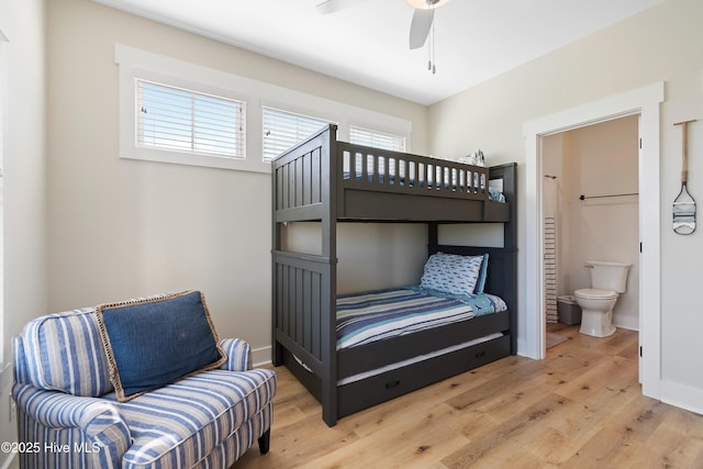 1063 Tide Ridge Dr, Supply, NC 28462 - bedroom featuring wood finished floors, ensuite bath, baseboards, and a ceiling fan