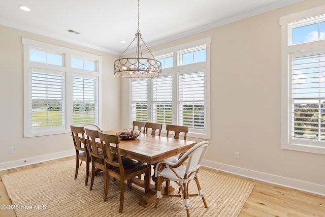 1063 Tide Ridge Dr, Supply, NC 28462 - dining room featuring healthy amount of natural light, crown molding, baseboards, and recessed lighting