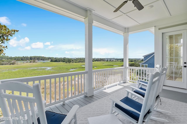 1063 Tide Ridge Dr, Supply, NC 28462 - wooden terrace with ceiling fan and a water view