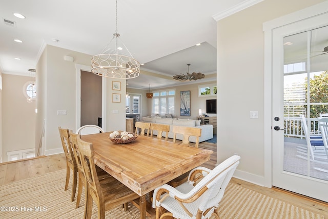 1063 Tide Ridge Dr, Supply, NC 28462 - dining room featuring crown molding, light wood-style floors, baseboards, recessed lighting, and a raised ceiling