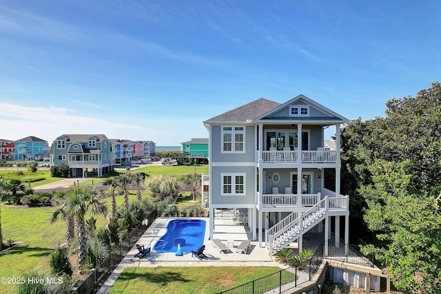 1063 Tide Ridge Dr, Supply, NC 28462 - back of property featuring a balcony, stairway, and a patio