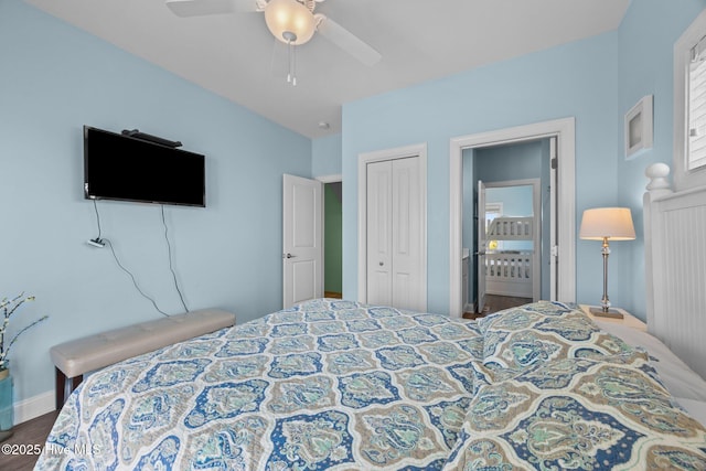 bedroom with a closet, wood finished floors, a ceiling fan, and baseboards