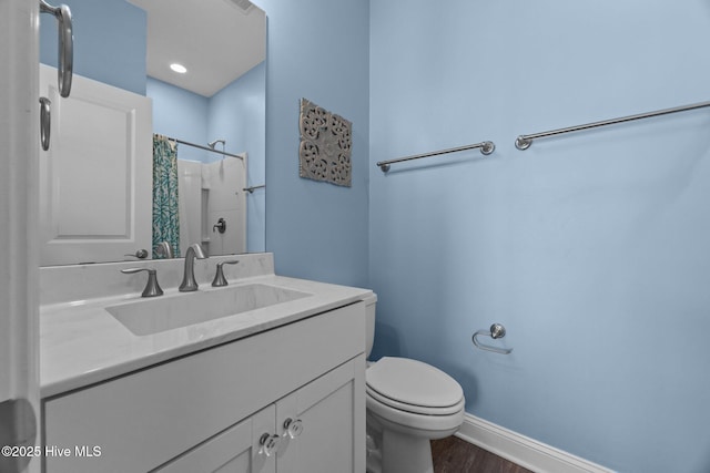 full bathroom featuring toilet, baseboards, wood finished floors, vanity, and a shower with shower curtain