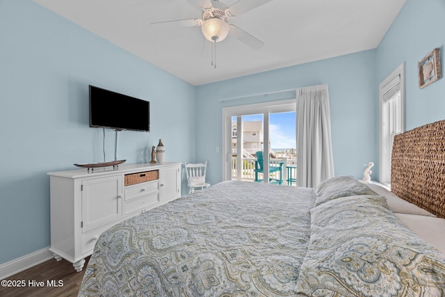 bedroom featuring access to outside, dark wood-style floors, baseboards, and ceiling fan