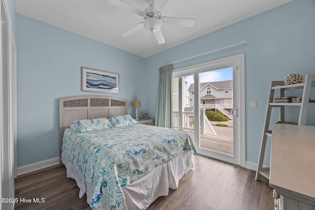 bedroom featuring access to exterior, wood finished floors, and baseboards