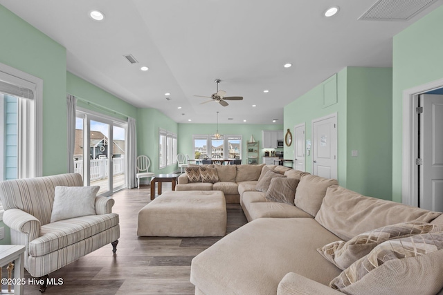 living room featuring recessed lighting, wood finished floors, and a ceiling fan