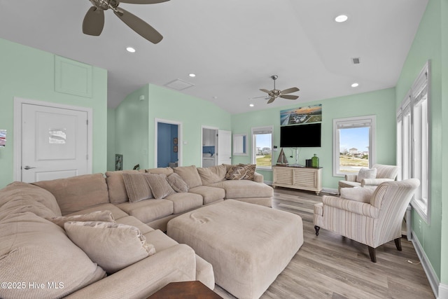 living area with ceiling fan, baseboards, recessed lighting, and light wood finished floors