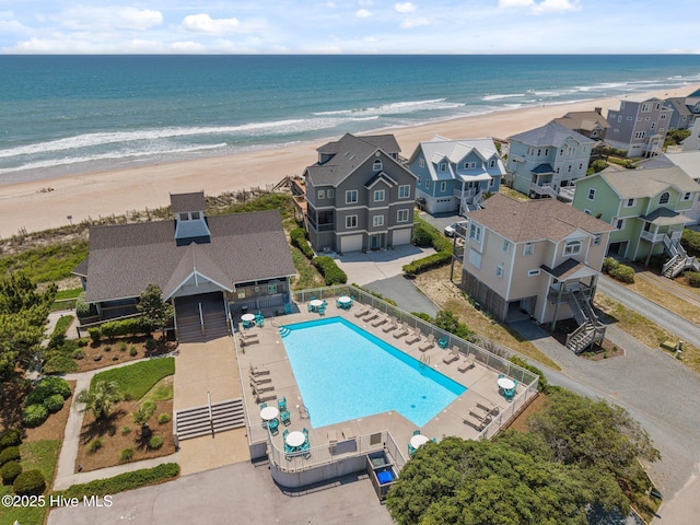 bird's eye view of a pool area and expansive beach