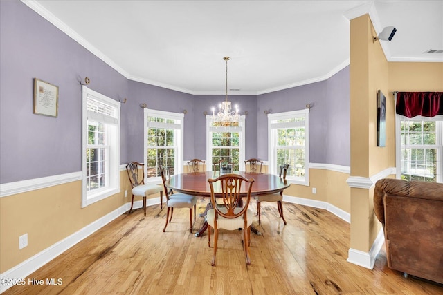 310 Garnercrest Rd, Wilmington, NC 28411 - dining area featuring light wood-style floors, baseboards, a chandelier, plenty of natural light, and ornamental molding