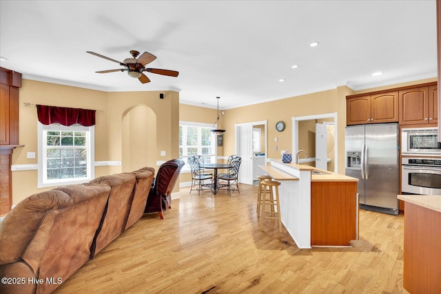 310 Garnercrest Rd, Wilmington, NC 28411 - kitchen featuring stainless steel appliances, open floor plan, a ceiling fan, healthy amount of natural light, and crown molding