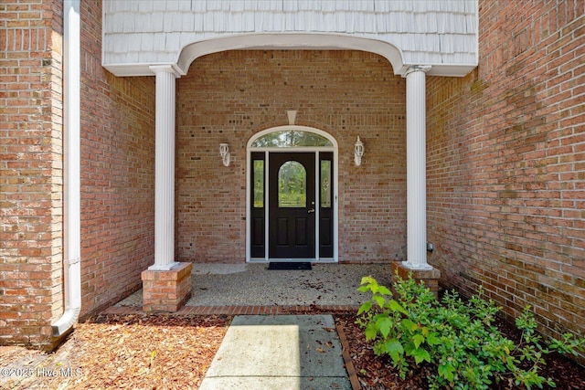 310 Garnercrest Rd, Wilmington, NC 28411 - property entrance featuring brick siding, mansard roof, and a porch