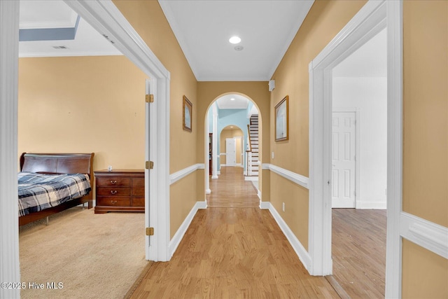 310 Garnercrest Rd, Wilmington, NC 28411 - hall featuring arched walkways, light wood-style floors, crown molding, and baseboards