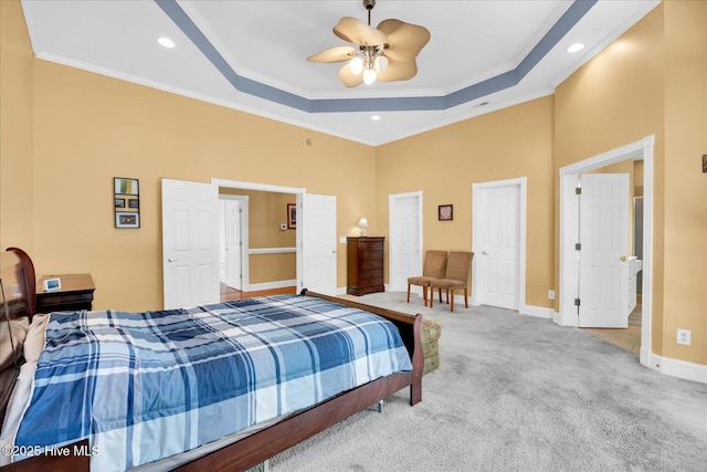 310 Garnercrest Rd, Wilmington, NC 28411 - carpeted bedroom with crown molding, baseboards, a raised ceiling, a high ceiling, and a ceiling fan