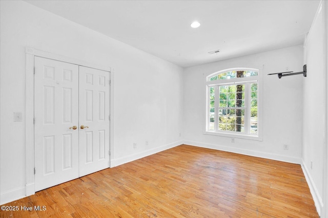 310 Garnercrest Rd, Wilmington, NC 28411 - unfurnished bedroom with wood finished floors, baseboards, a closet, and recessed lighting