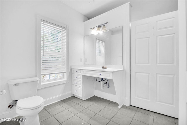 310 Garnercrest Rd, Wilmington, NC 28411 - bathroom with toilet, baseboards, tile patterned flooring, and vanity