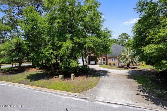 310 Garnercrest Rd, Wilmington, NC 28411 - obstructed view of property with curved driveway