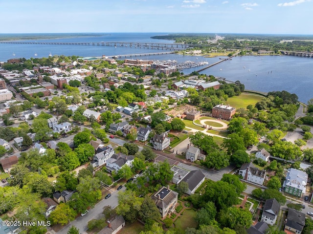aerial view of residential area with a notable bridge and a large body of water