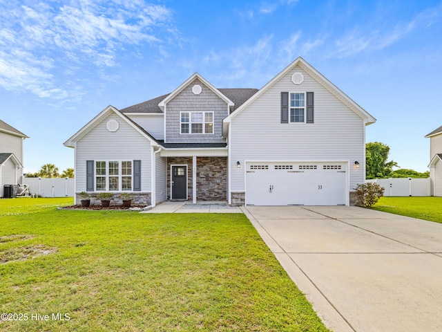 303 Little Egret Ln, Swansboro, NC 28584 - view of front of property featuring driveway, an attached garage, and stone siding