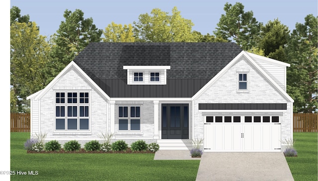view of front facade with concrete driveway, a standing seam roof, metal roof, and brick siding