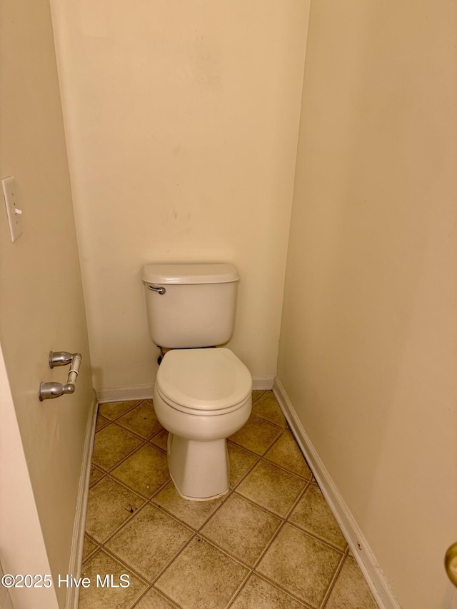2400 King Richard Ct Unit D, Greenville, NC 27858 - bathroom with toilet, tile patterned floors, and baseboards