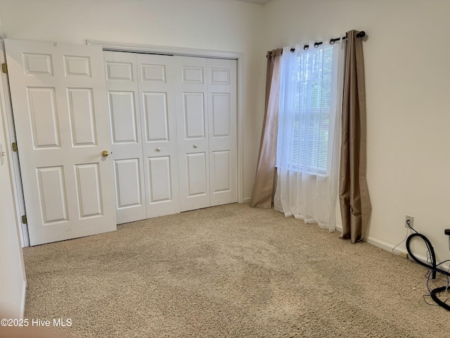 2400 King Richard Ct Unit D, Greenville, NC 27858 - unfurnished bedroom featuring carpet flooring, a closet, and baseboards