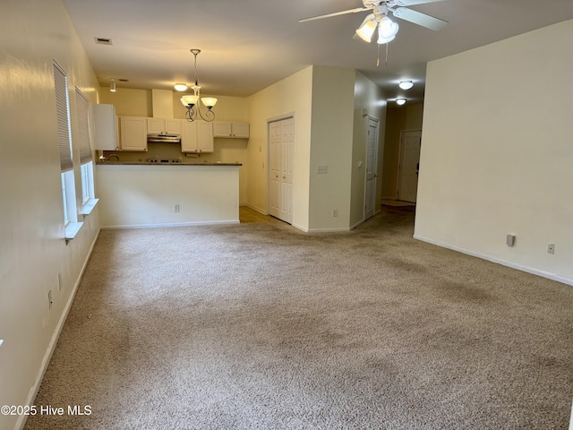 2400 King Richard Ct Unit D, Greenville, NC 27858 - unfurnished living room featuring a ceiling fan, carpet flooring, and baseboards