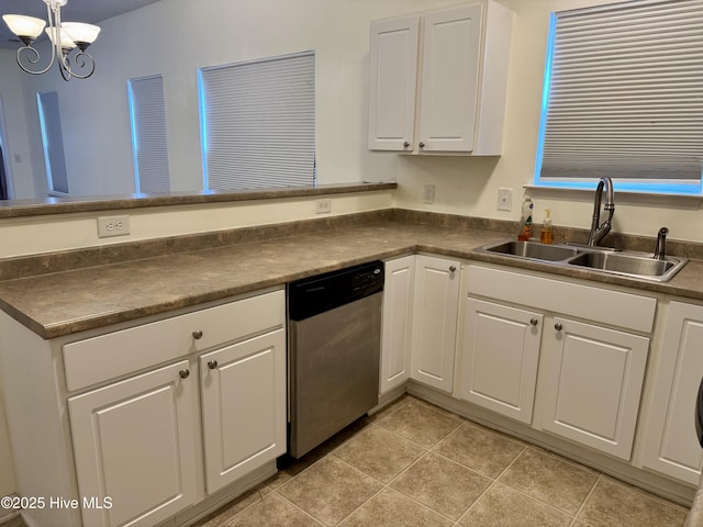 2400 King Richard Ct Unit D, Greenville, NC 27858 - kitchen featuring stainless steel dishwasher, a sink, dark countertops, white cabinets, and a chandelier