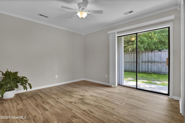 7404 Countywood Way, Wilmington, NC 28411 - unfurnished room with wood finished floors, ceiling fan, baseboards, crown molding, and a textured ceiling