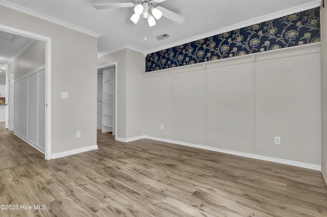 7404 Countywood Way, Wilmington, NC 28411 - unfurnished bedroom featuring wood finished floors, crown molding, ceiling fan, and baseboards
