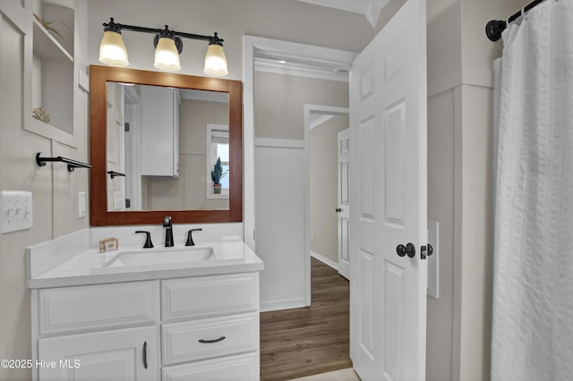 7404 Countywood Way, Wilmington, NC 28411 - full bath featuring wood finished floors, vanity, and baseboards