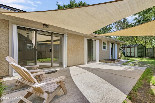 7404 Countywood Way, Wilmington, NC 28411 - view of patio / terrace with a storage unit and an outbuilding