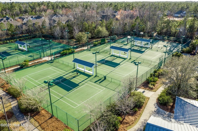 1106 Jamesford Ct, Leland, NC 28451 - view of tennis court with a wooded view