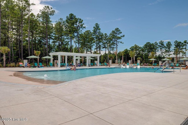 1106 Jamesford Ct, Leland, NC 28451 - community pool with a pergola and a patio area