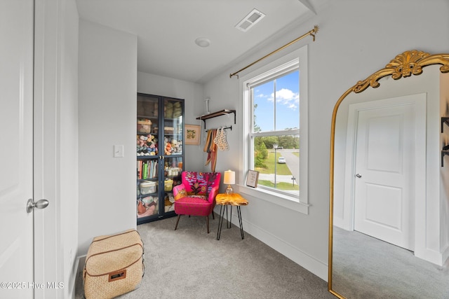 sitting room with carpet and baseboards