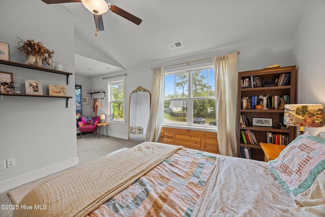 carpeted bedroom with vaulted ceiling, baseboards, multiple windows, and ceiling fan